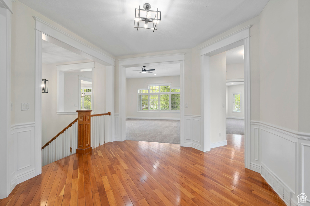 Corridor with light hardwood / wood-style floors and plenty of natural light