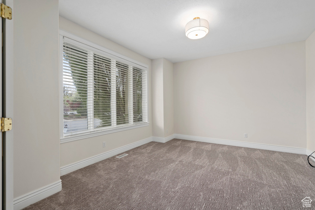 View of carpeted spare room