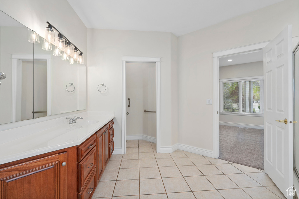 Bathroom with vanity and tile floors