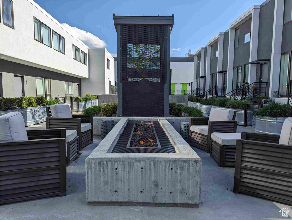 View of patio / terrace featuring an outdoor living space with a fire pit