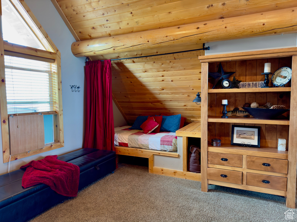 Bedroom with lofted ceiling, radiator, carpet floors, and wood ceiling