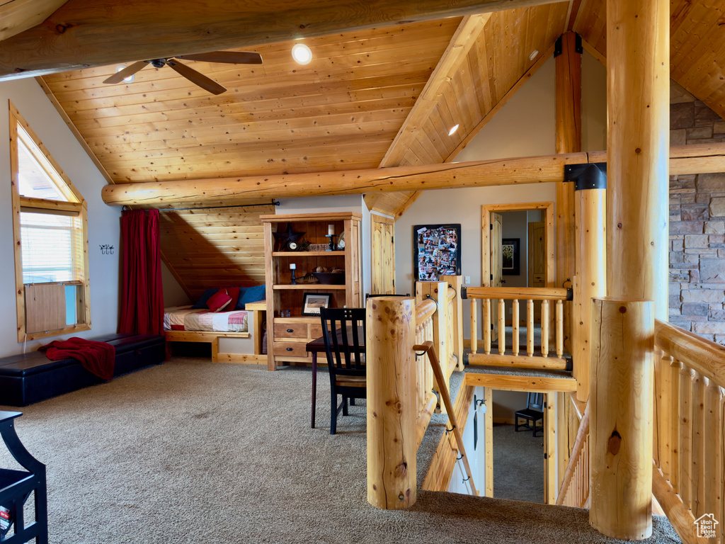 Bedroom featuring wood ceiling, carpet, and vaulted ceiling with beams
