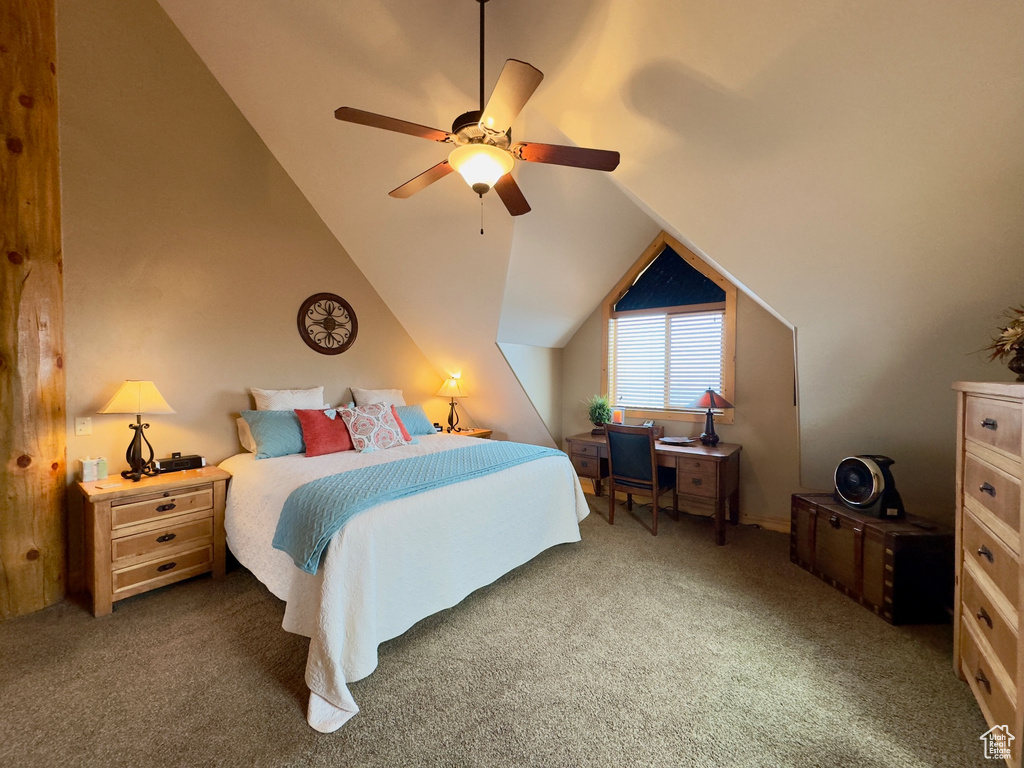 Bedroom featuring ceiling fan, carpet floors, and vaulted ceiling