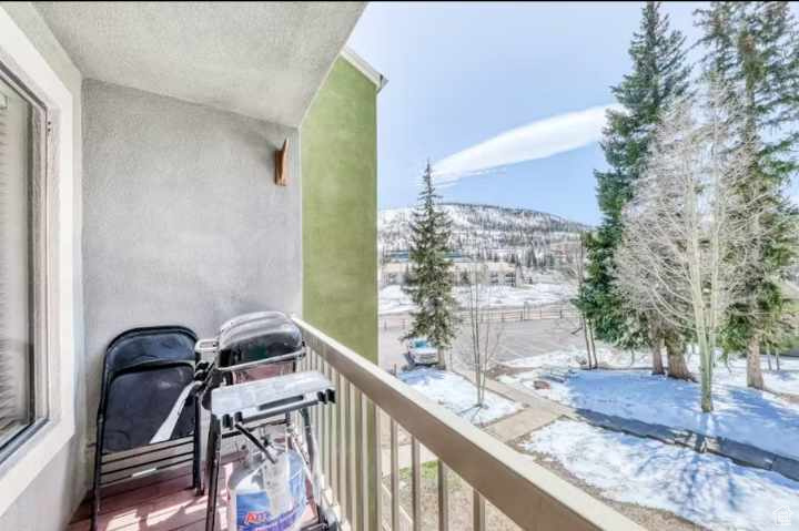 View of snow covered back of property