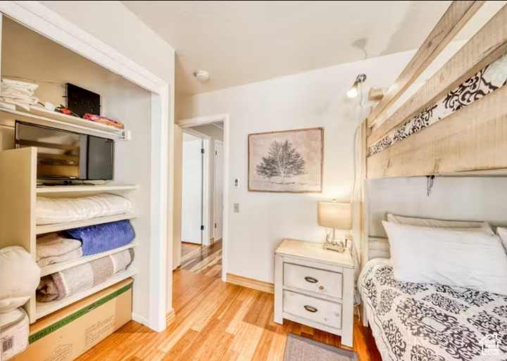 Bedroom with light hardwood / wood-style floors