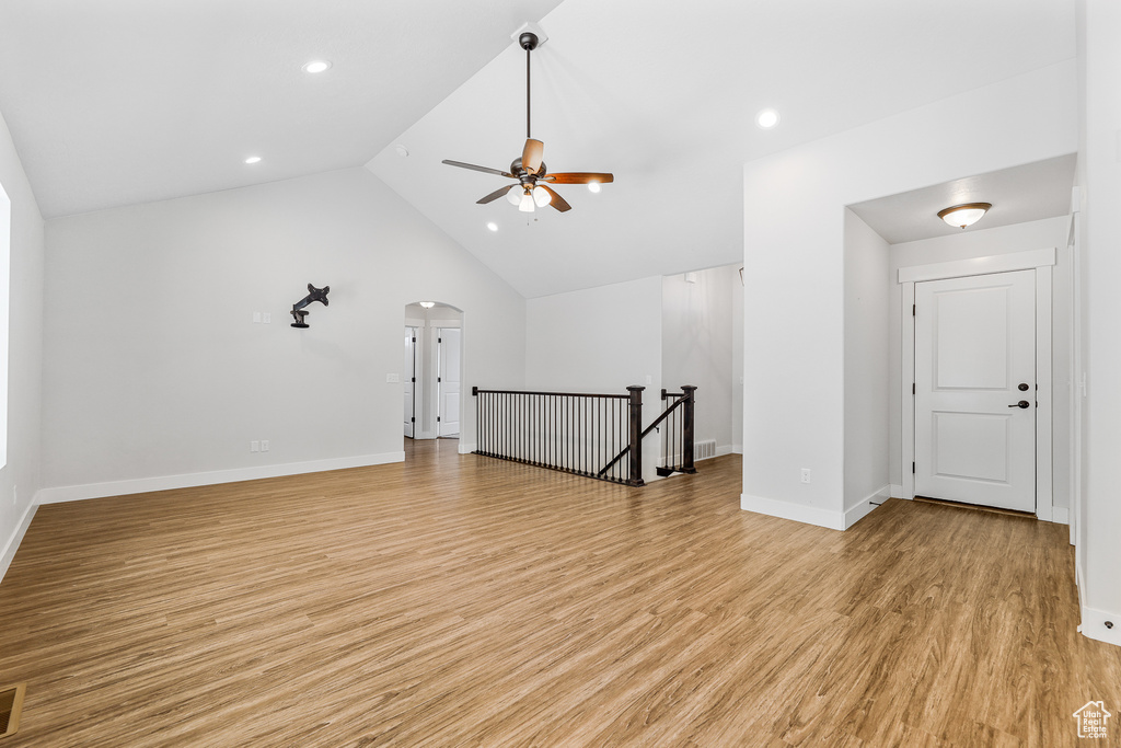 Bonus room featuring high vaulted ceiling, light hardwood / wood-style floors, and ceiling fan