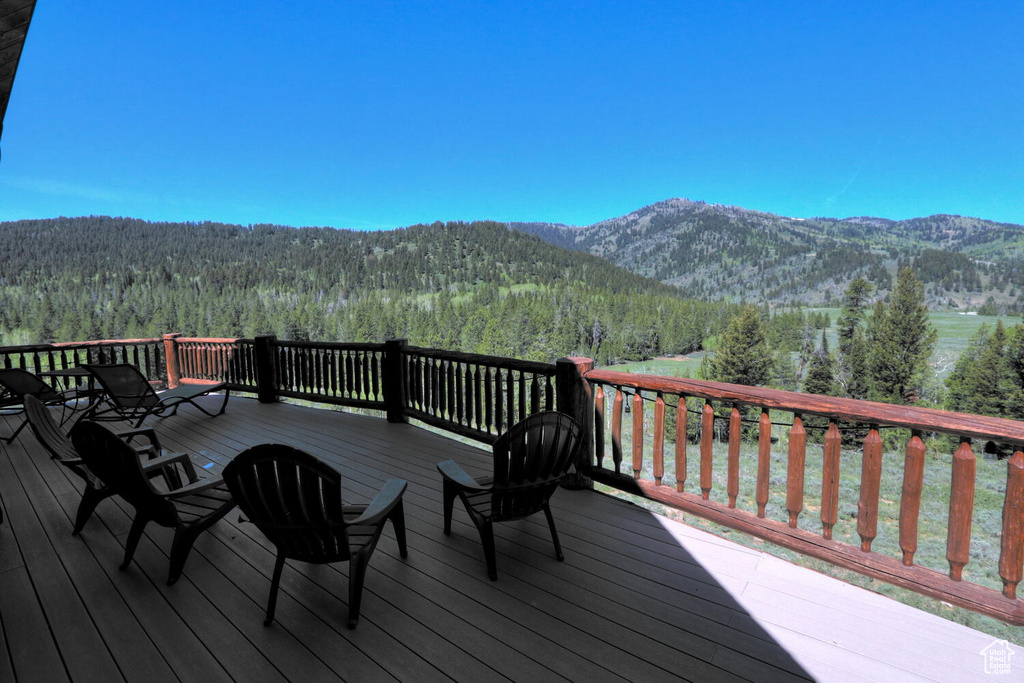 Wooden deck featuring a mountain view