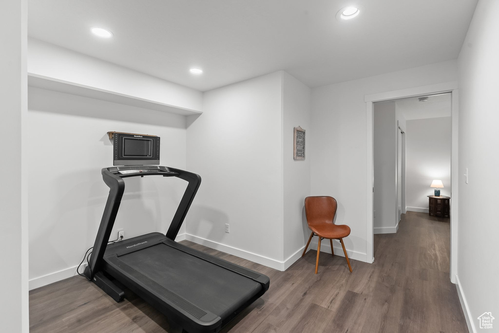 Exercise area featuring dark hardwood / wood-style floors