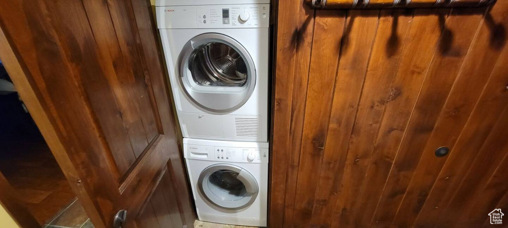 Laundry area featuring stacked washer and dryer
