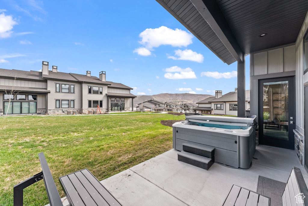 View of patio / terrace with a hot tub