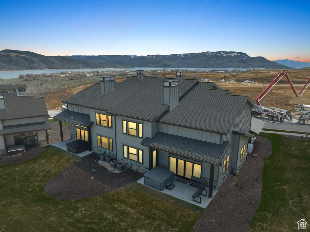 Aerial view at dusk featuring a mountain view