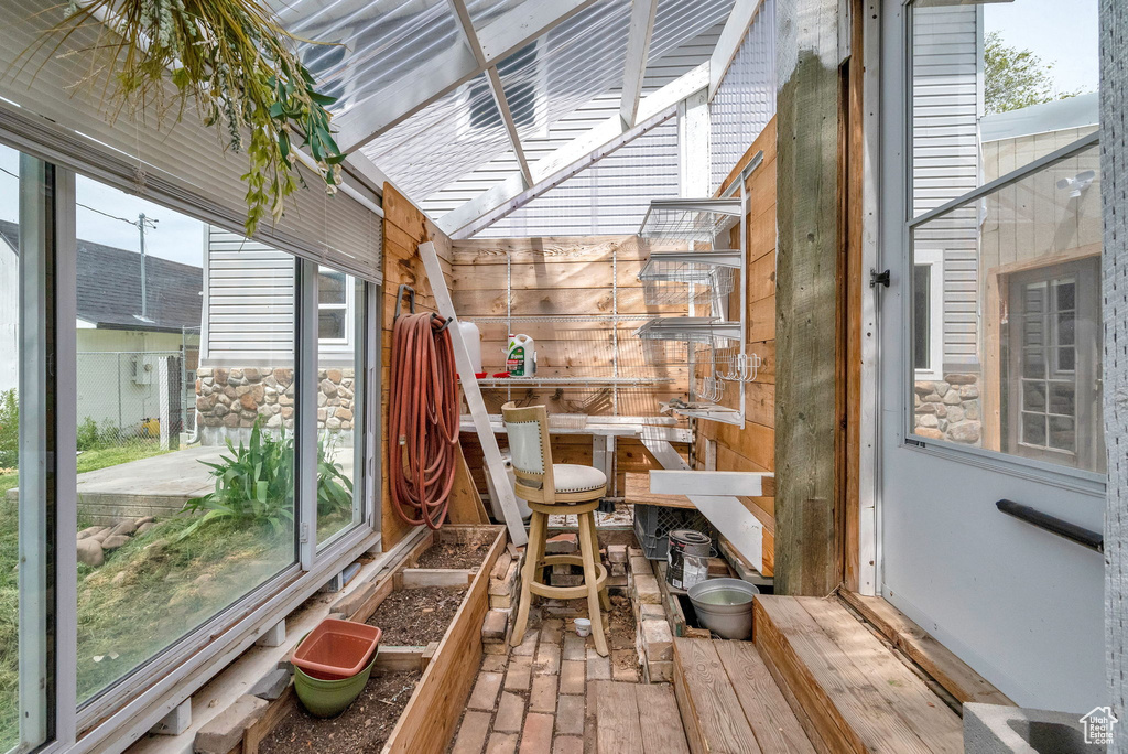Unfurnished sunroom featuring plenty of natural light
