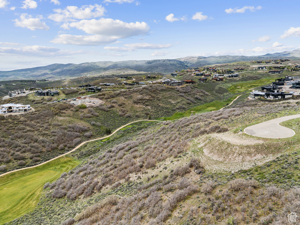 Bird\\\\\\\'s eye view of a mountain backdrop and a golf course