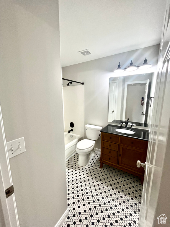 Full bathroom featuring tile patterned flooring, vanity, toilet, and shower / bathing tub combination