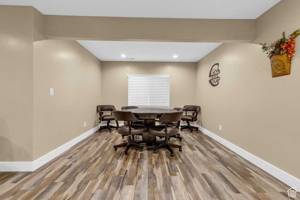 Dining area with hardwood / wood-style flooring