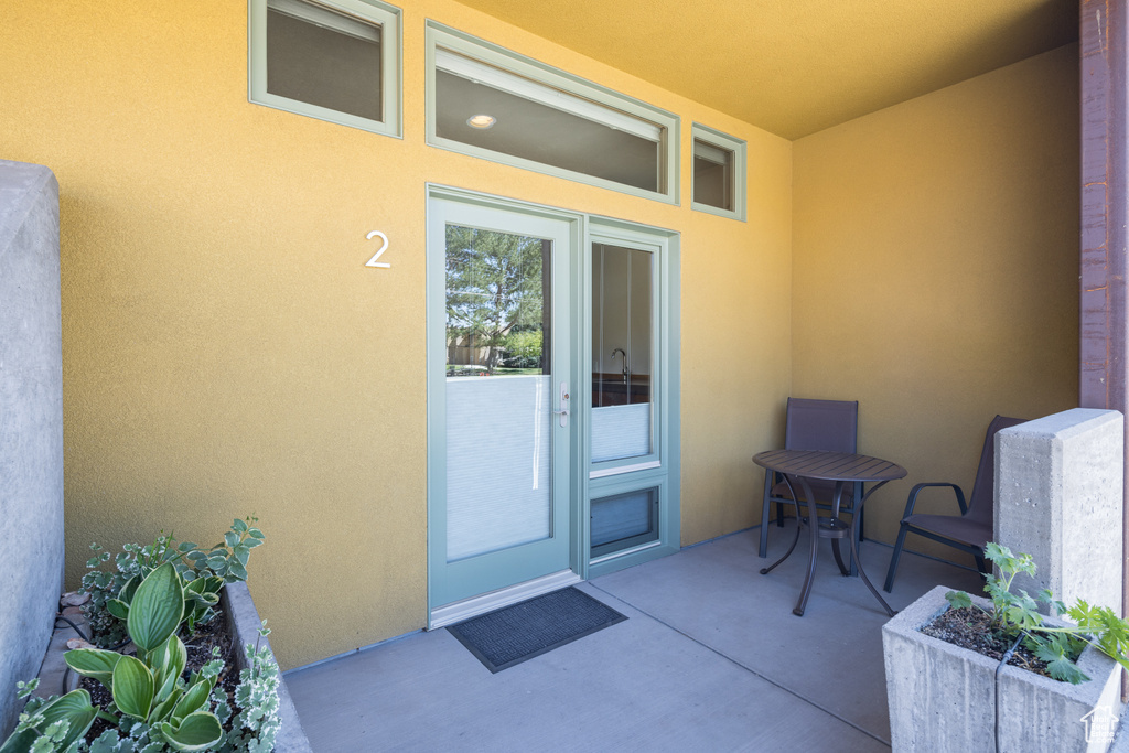 Doorway to property with a patio