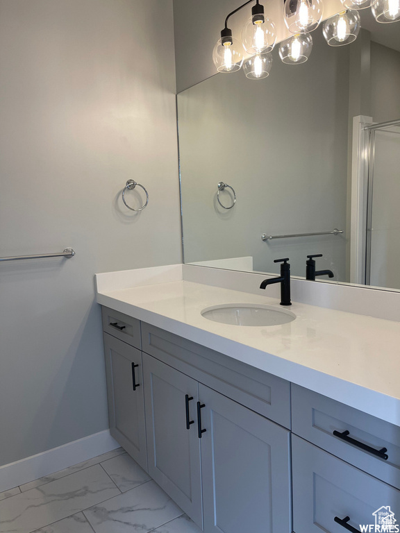 Bathroom featuring vanity and tile floors