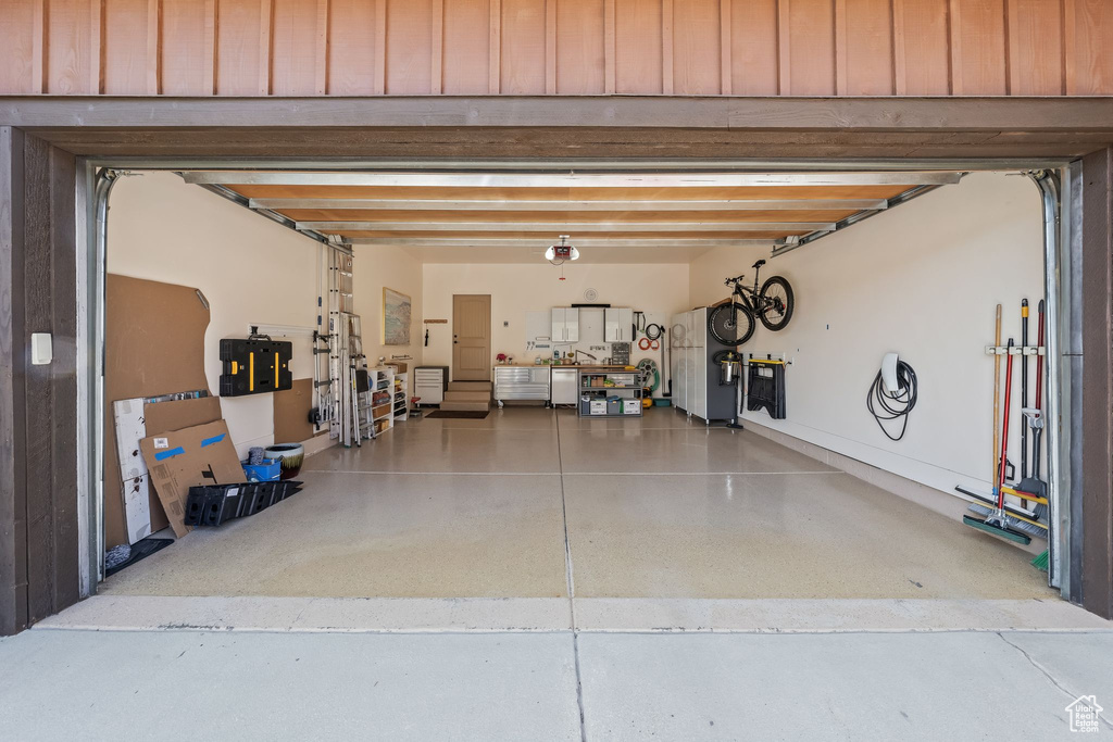 Garage with stainless steel fridge with ice dispenser