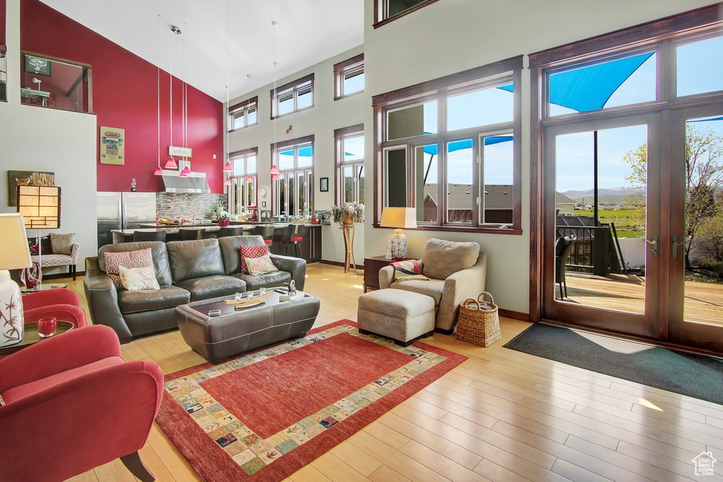 Interior space featuring a healthy amount of sunlight and a high ceiling