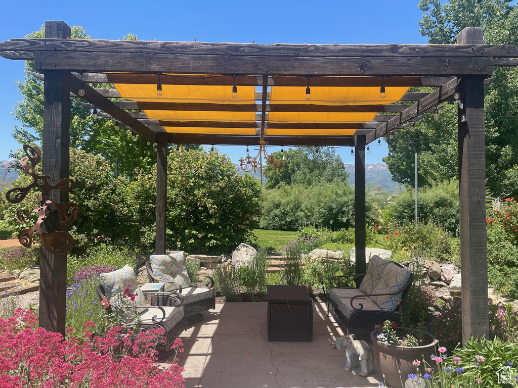 View of patio / terrace with an outdoor living space and a pergola