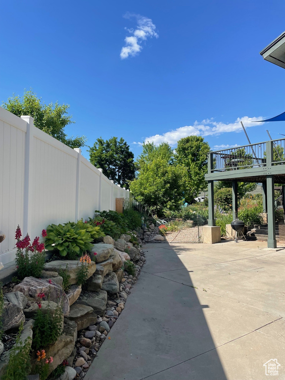 Exterior space featuring a patio and a deck