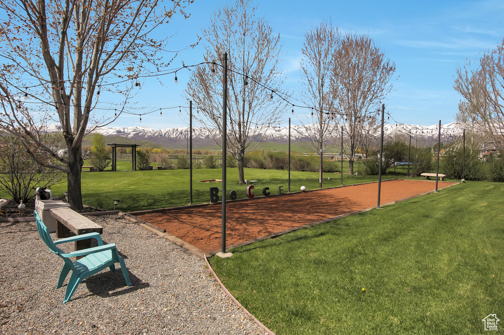 View of nearby features featuring a mountain view and a yard