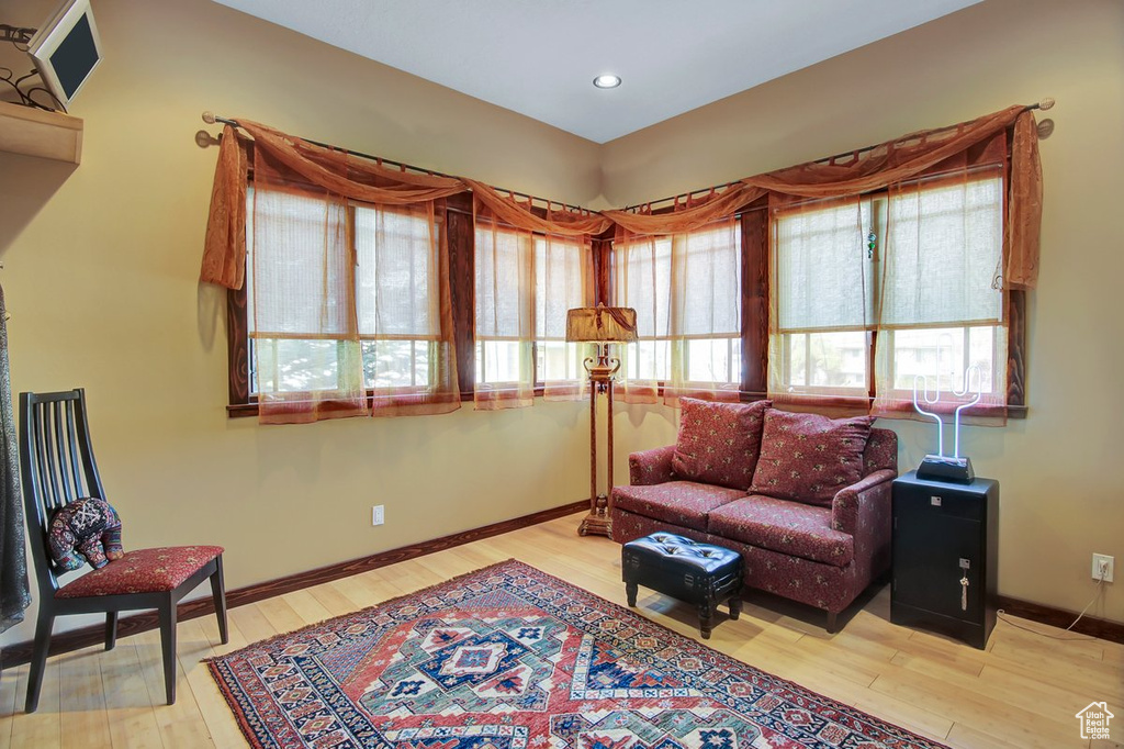 Living area with hardwood / wood-style floors