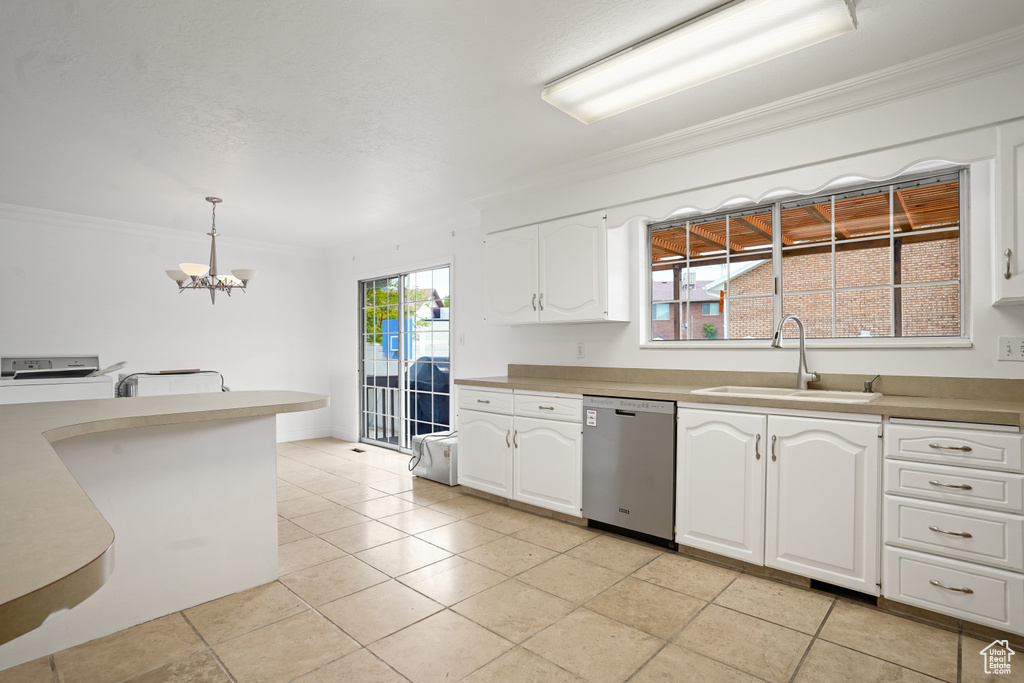 Kitchen with white cabinets, light tile flooring, and dishwasher