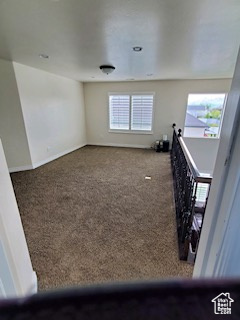 Spare room featuring carpet