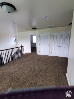 Staircase with dark carpet