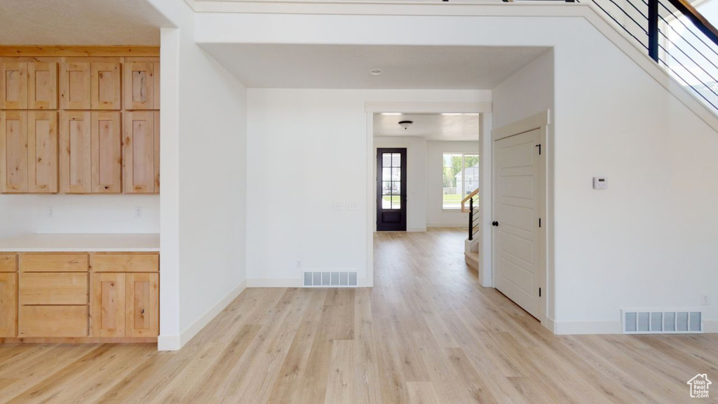 Hallway featuring light wood-type flooring