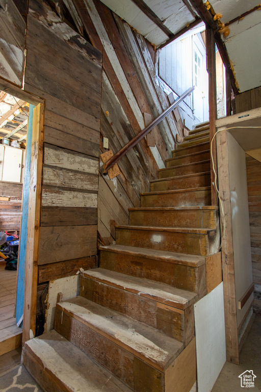 Stairs with wood walls