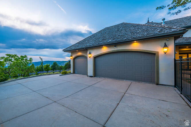 Property exterior at dusk with a garage