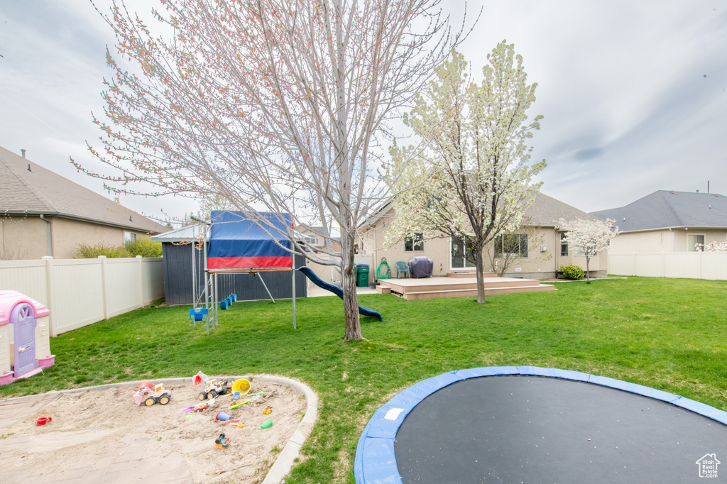 View of yard featuring a trampoline