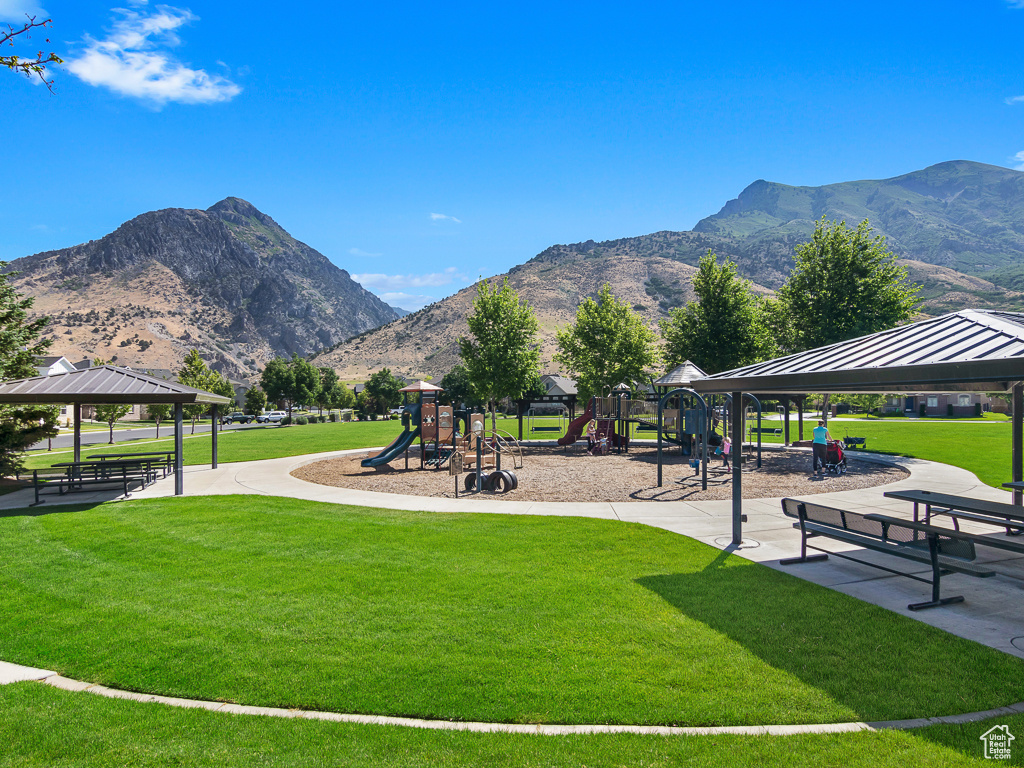 View of nearby features featuring a mountain view, a yard, a playground, and a gazebo