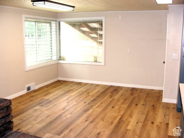 Spare room featuring hardwood / wood-style floors
