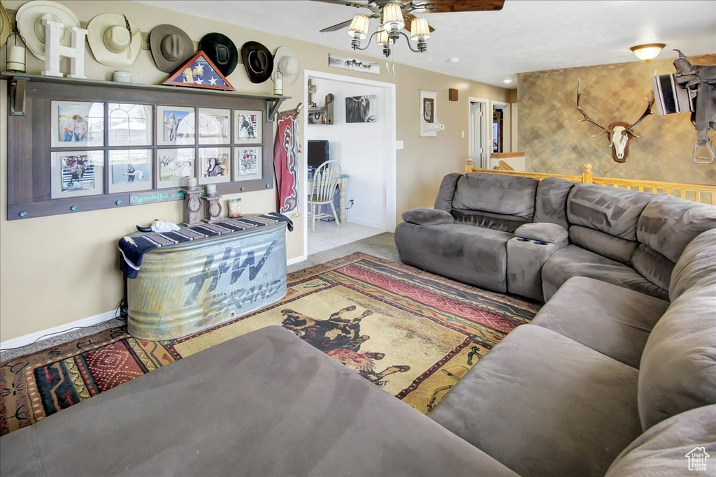 Living room with tile flooring and ceiling fan