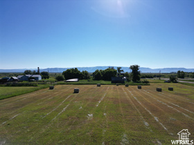 Birds eye view of property featuring a rural view