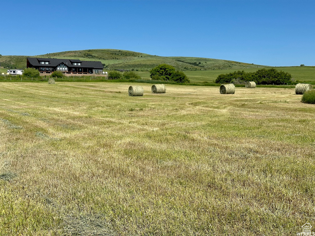 View of yard with a rural view