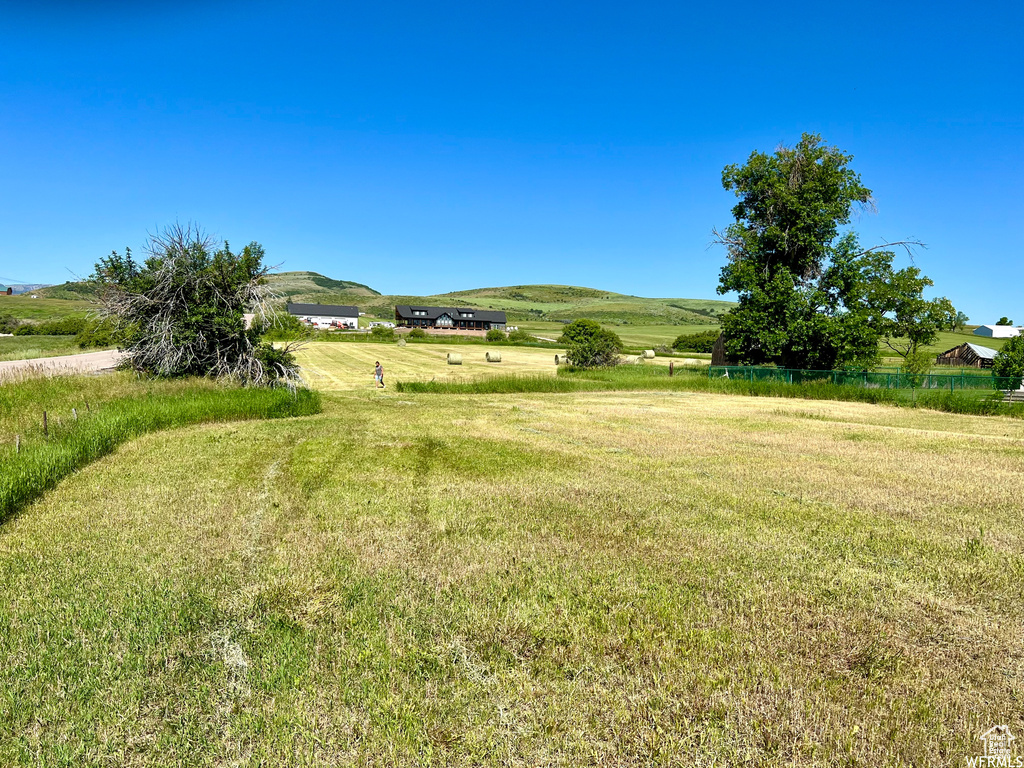 View of yard with a rural view