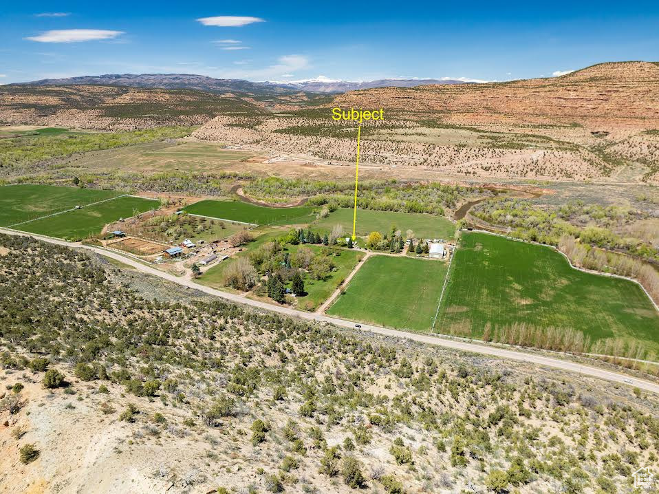 Drone / aerial view featuring a rural view and a mountain view