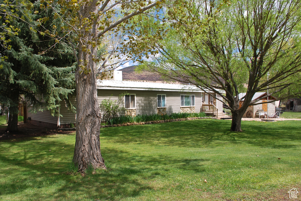 View of front of property with a front yard