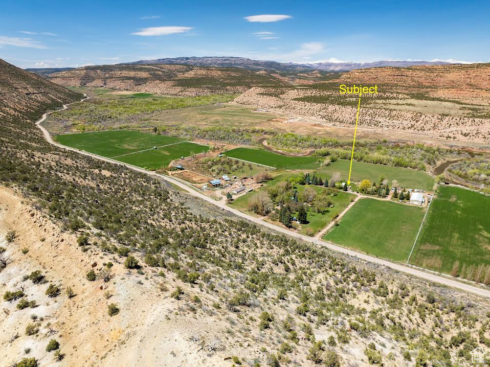 Birds eye view of property featuring a rural view