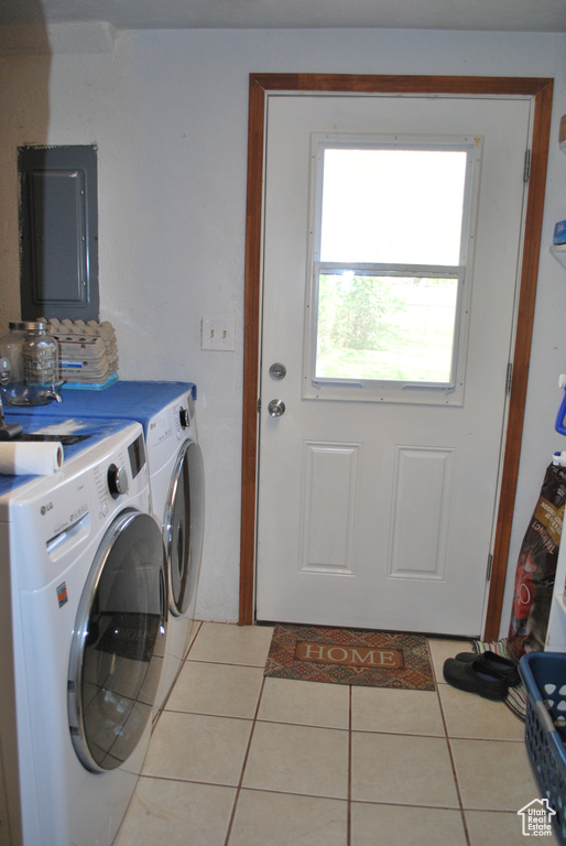 Laundry area with washer and dryer and tile floors