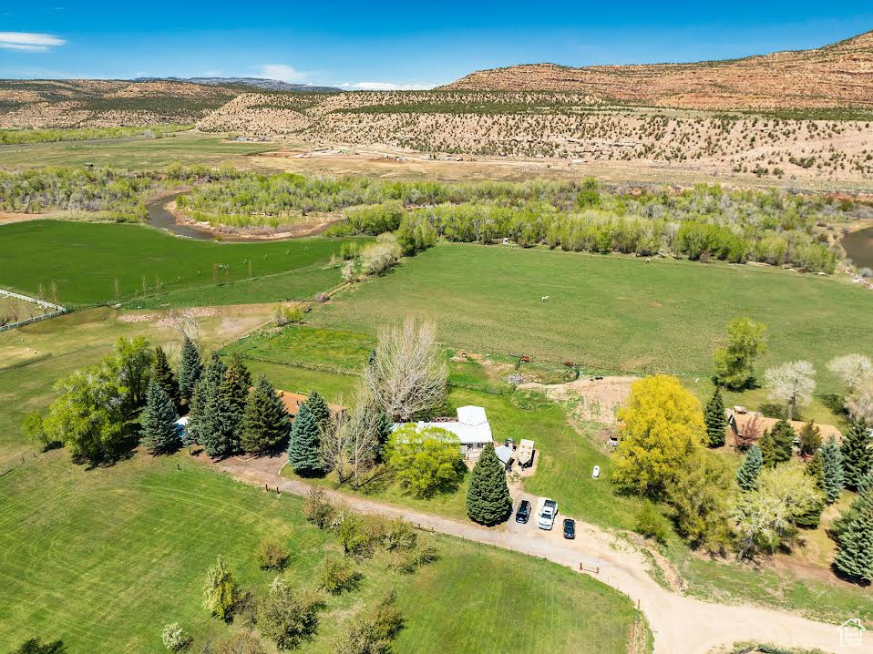 Birds eye view of property featuring a mountain view and a rural view