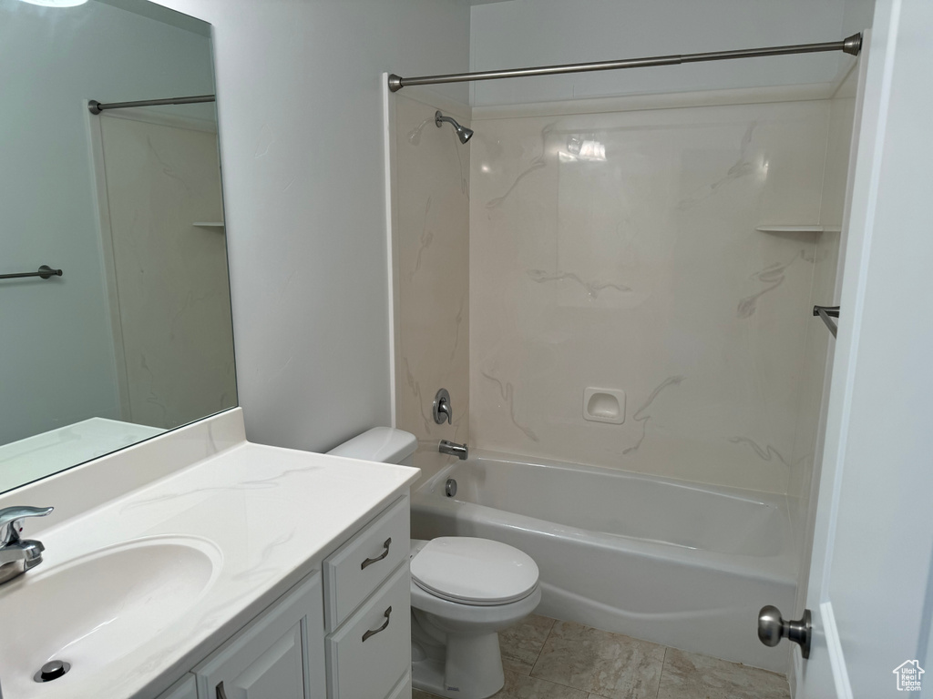 Full bathroom featuring shower / washtub combination, tile flooring, vanity, and toilet