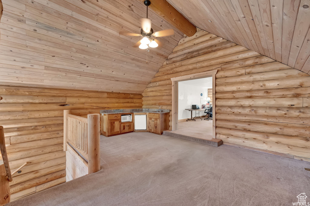 Bonus room featuring log walls, ceiling fan, light carpet, wood ceiling, and lofted ceiling