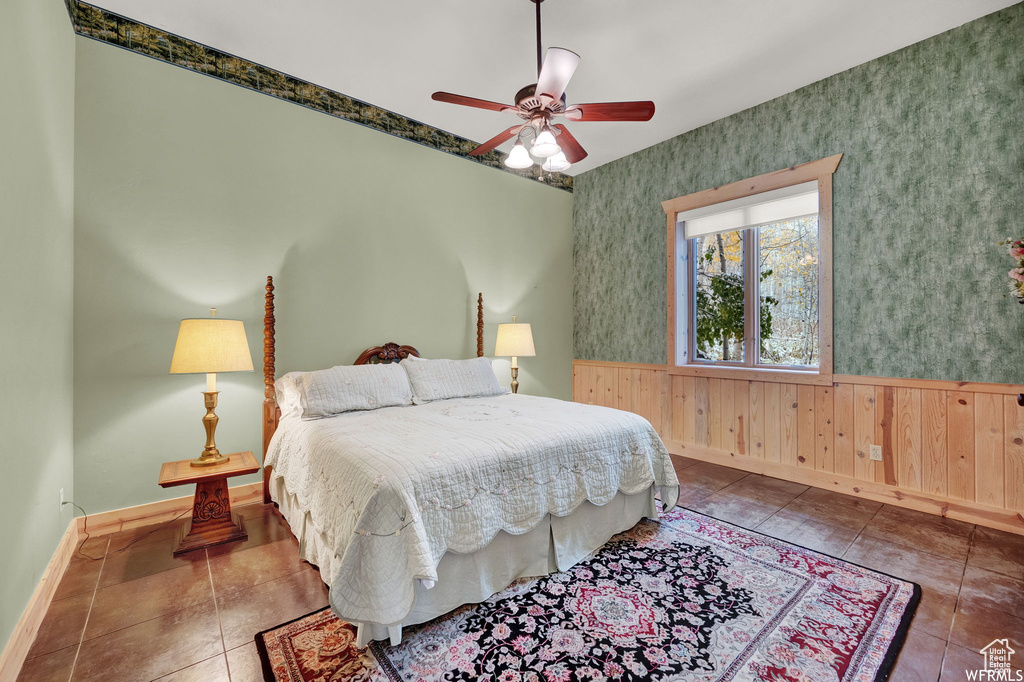 Bedroom with ceiling fan and tile flooring