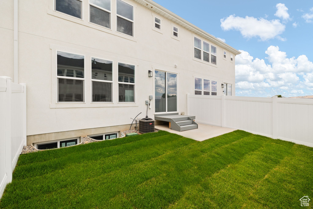 Back of property featuring stucco siding