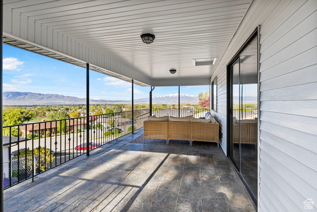 Unfurnished sunroom featuring a mountain view